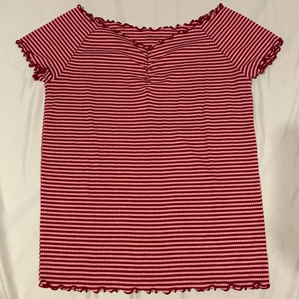 red/pink frilled shirt